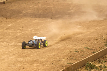 Obraz premium Radio controlled car model in race on dirt track