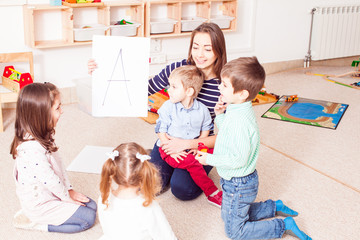 Teacher teaches preschoolers