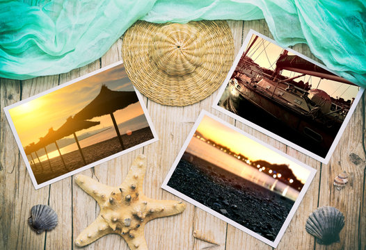 Summer photos on a wooden table with beach objects