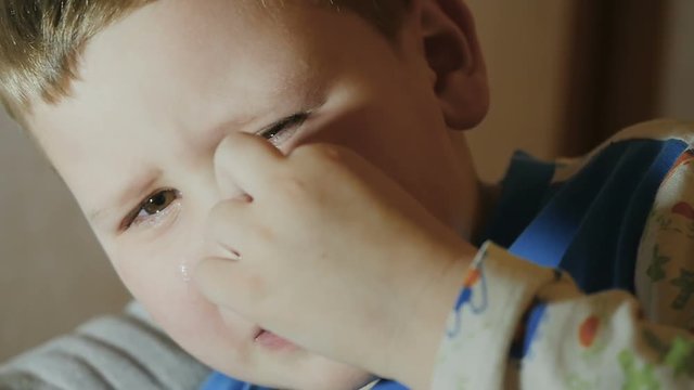 the baby is crying. slow motion. a child dripping Teardrop