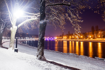 Night view of snow-covered embankment