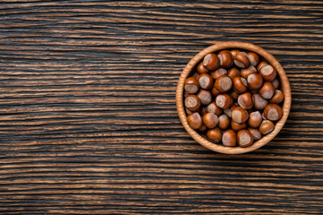 hazelnut on a brown wooden table,top view