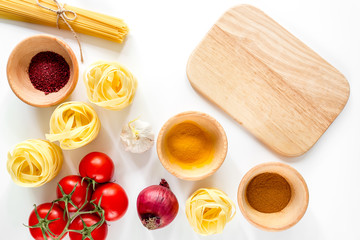 Preparing for cooking italian pasta white background top view mock up