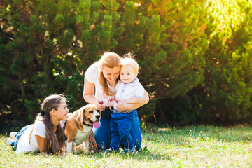 Fototapeta premium Mom with kids on a walk