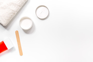 Preparing for depilation with wax on white background top view copyspace
