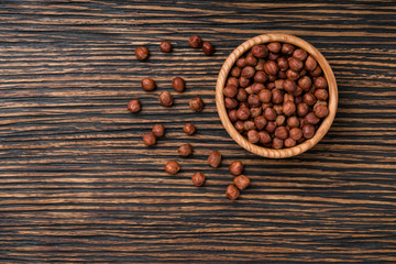 hazelnut on a brown wooden table,top view