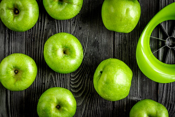 green apples close up pattern dark wooden desk background top view