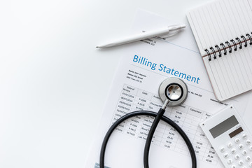 health care billing statement with doctor's stethoscope on white background top view mock-up