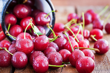 Sweet fresh ripe cherry pour out of a mug