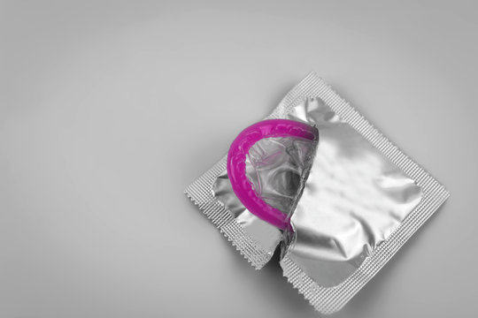 Condom close-up isolated. Contraceptive protection from pregnancy, AIDS.