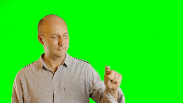 Advertising template with finger hands gestures adult men with alpha channel green screen. Adult caucasian bald man gestures. Casual shirt jeans adult men. Green screen background. Modern technology.