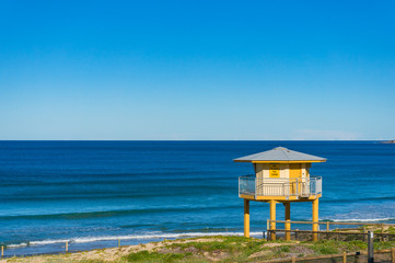 Rescue tower on the beach with blue ocean view