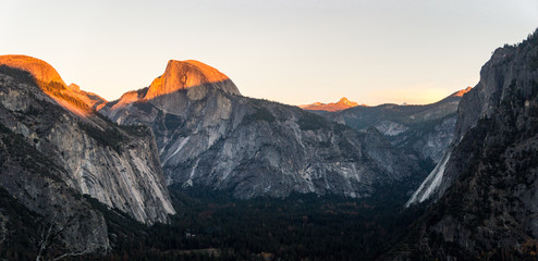 sunset across half dome mountains in yosemite