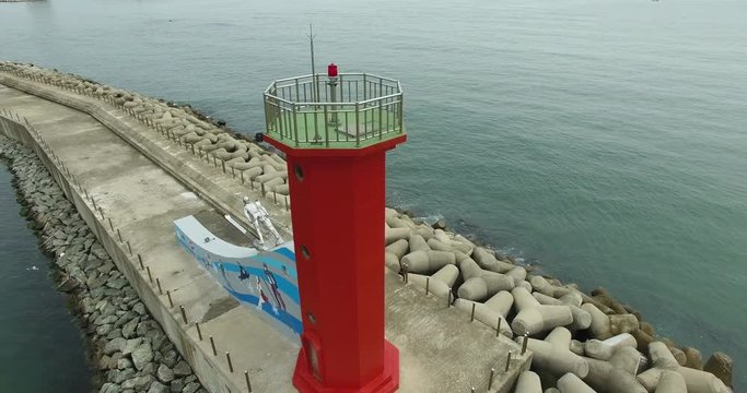 Red lighthouse closeup of bird's-eye view . Filming drone