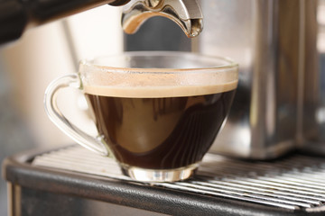 Hot coffee in a cup made from espresso machine