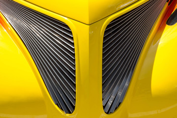 Symmetric triangular grille on a yellow car