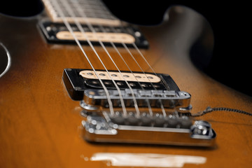 Fototapeta na wymiar Brown electric guitar detail