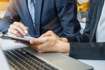 Team work process. young business managers crew working with new startup project. tablet on wood table, typing keyboard, texting message, analyse graph plans