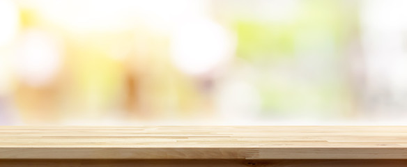 Wood table top on abstract bokeh banner background