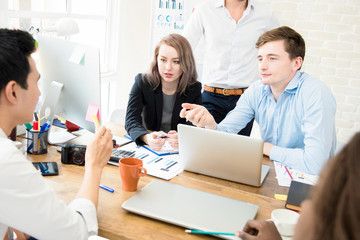 Casual business people discussing work