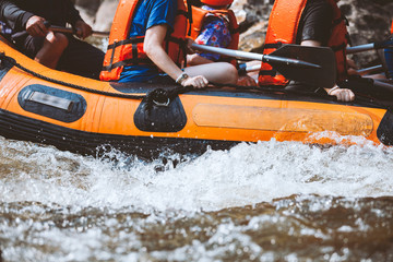 Young person rafting on the river, extreme and fun sport at tourist attraction