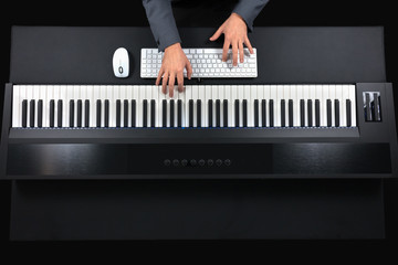Pianist playing electric piano with jacket