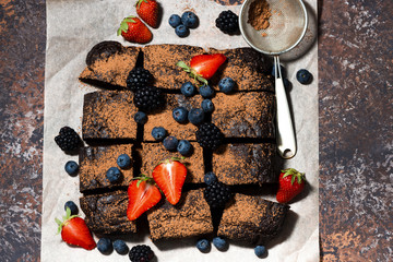 dessert - chocolate brownies with fresh berries, top view