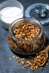 homemade baked granola in a glass jar, top view