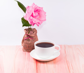 White cup and black coffee ,flower