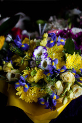 various bouquets of flowers on a black background