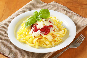 Ribbon pasta with tomato paste and Parmesan