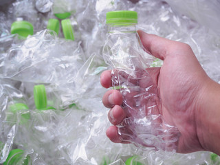 man hand hold plastic bottles, recycle and safe the world from global warming concept