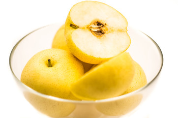 Naklejka na ściany i meble pears in a crystal bowl isolated on white background