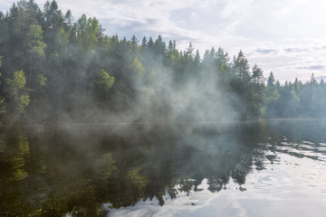 Smoke on the lake, summer in Finland