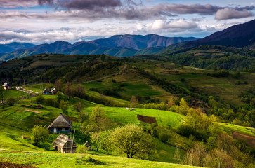 village on hills in dramatic mountain landscape