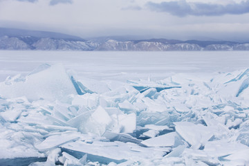 Fototapeta na wymiar Turquoise ice floes. Baikal lake winter landscape