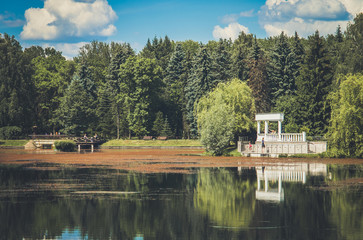 Summer river bank view with blue sky and light clouds