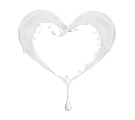 Splashes of milk in the shape of heart on white background