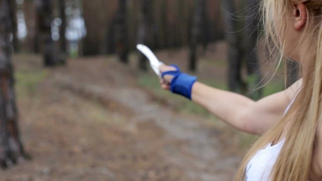 Girl throwing knives