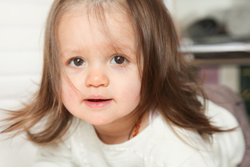 happy beautiful young girl kid in floor playing