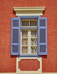 Fototapeta premium elegant vintage window on orange house wall