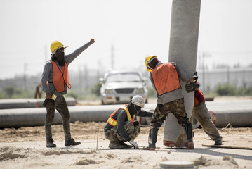 construction worker in construction site safety uniform install construction concrete pile driving...