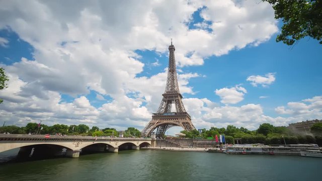 A timelapse of the Eiffel Tower and Pont d'I na along the river Seine with flyboats. Timelapse, 4K.
