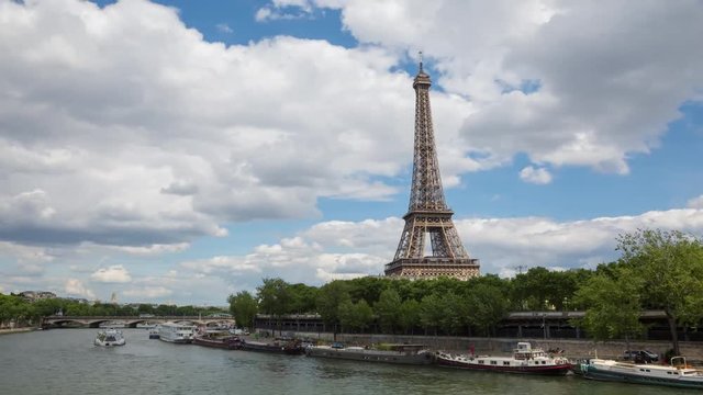 A timelapse of the Eiffel Tower and Pont d'I na along the river Seine with flyboats. Timelapse, 4K.