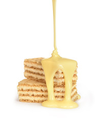sweet milk pouring on waffles cookies isolated
