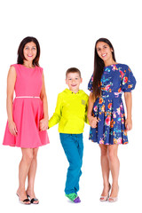 Obraz premium Two sports body figure tanned beautiful women, girlfriends, sisters in summer dress with brother, boy teen, son looking in camera. Isolated on white. Positive human emotion. Concept of friendly family