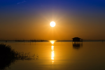 Sunset sky on the lake in south of Thailand., un-focus image.