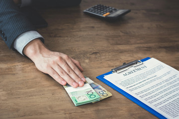 Businessman offer money while making an agreement