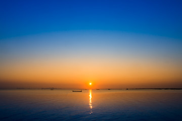 Sunset sky on the lake in south of Thailand., un-focus image.