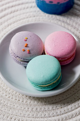 Macaroon pastel tones on a wooden background. Beautiful sweets